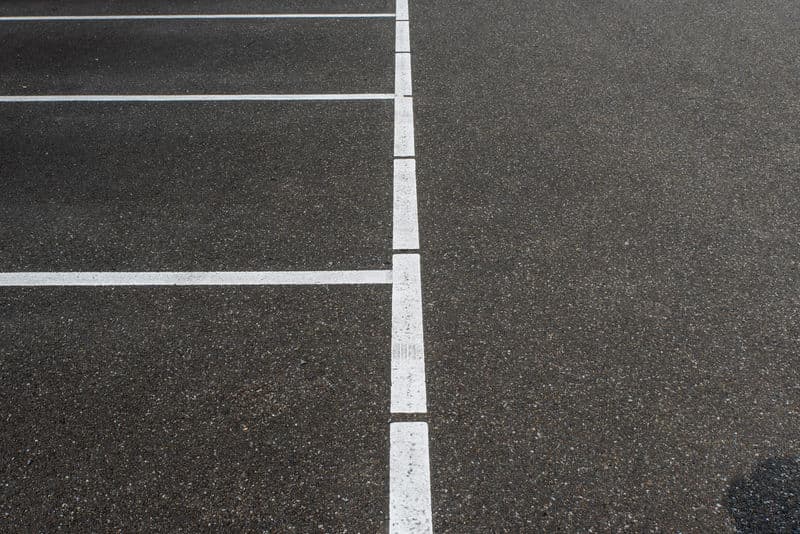 Commercial parking lot cleaned by pressure washing